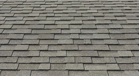 Close-up picture of architectural shingle roofing showing the texture and profile of the material