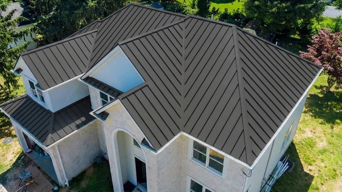 After: Grey shingle to charcoal standing seam