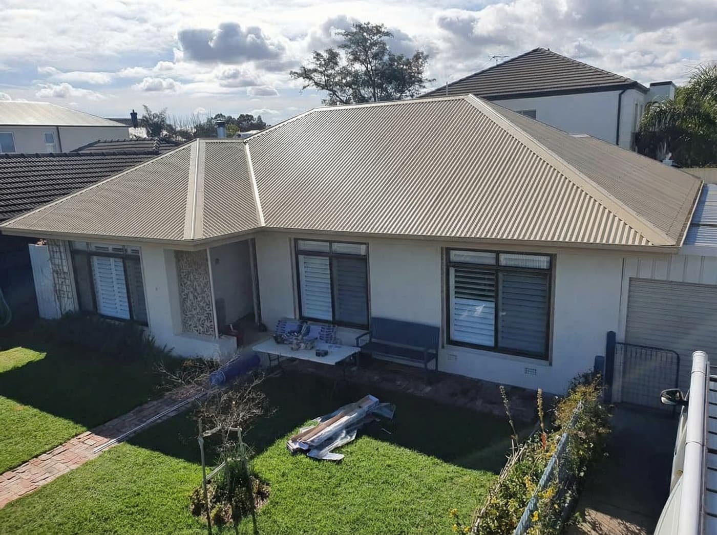 After: Concrete tile to corrugated metal